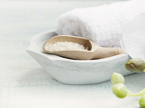 Spa still life with bath salt Spa still life setting with white orchid,bath salt and white towels